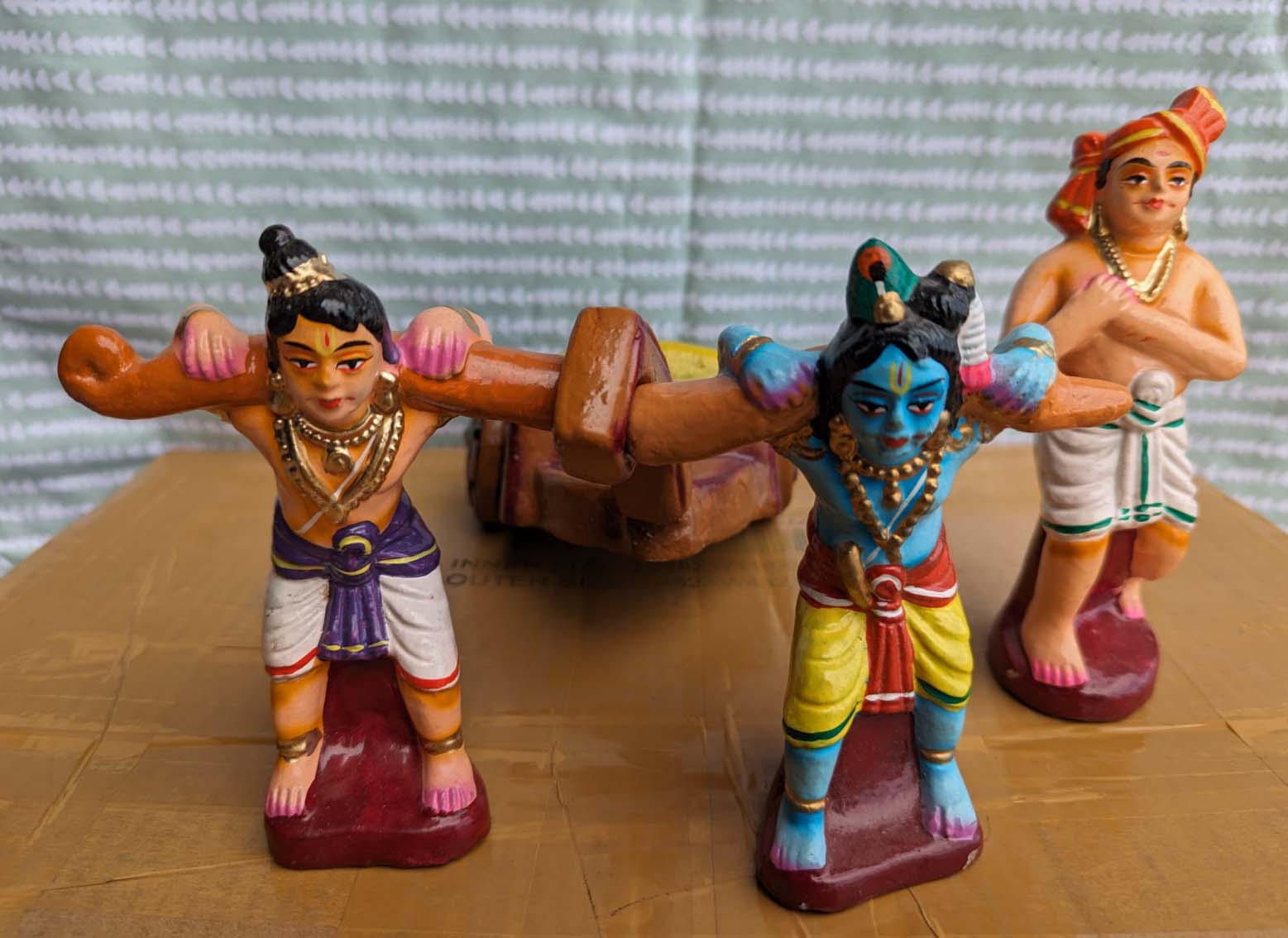 Krishna and Balaram pulling heavy object - Simple Smart Shopping